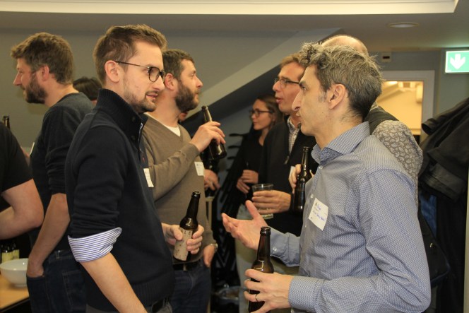 Attendees networking at GeoBeer #26 in Bern, photo 7